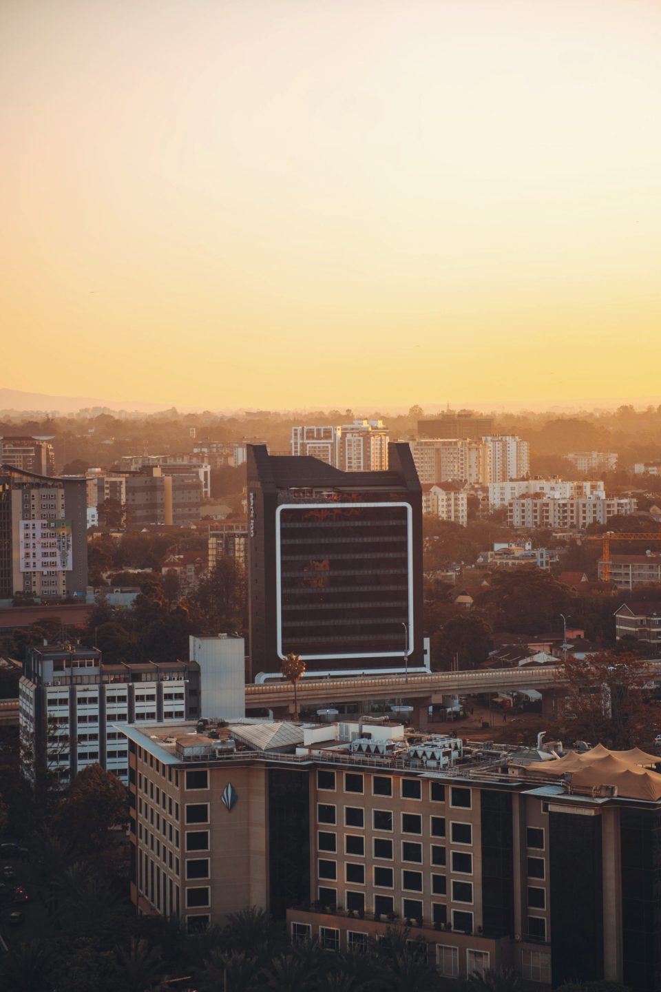 Nairobi rooftops and office towers at sunset